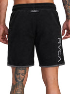Black athletic shorts with a gray ribbed hem, featuring a vertical white RVCA logo on the left leg and a small black brand tab at the waistband. Back View.