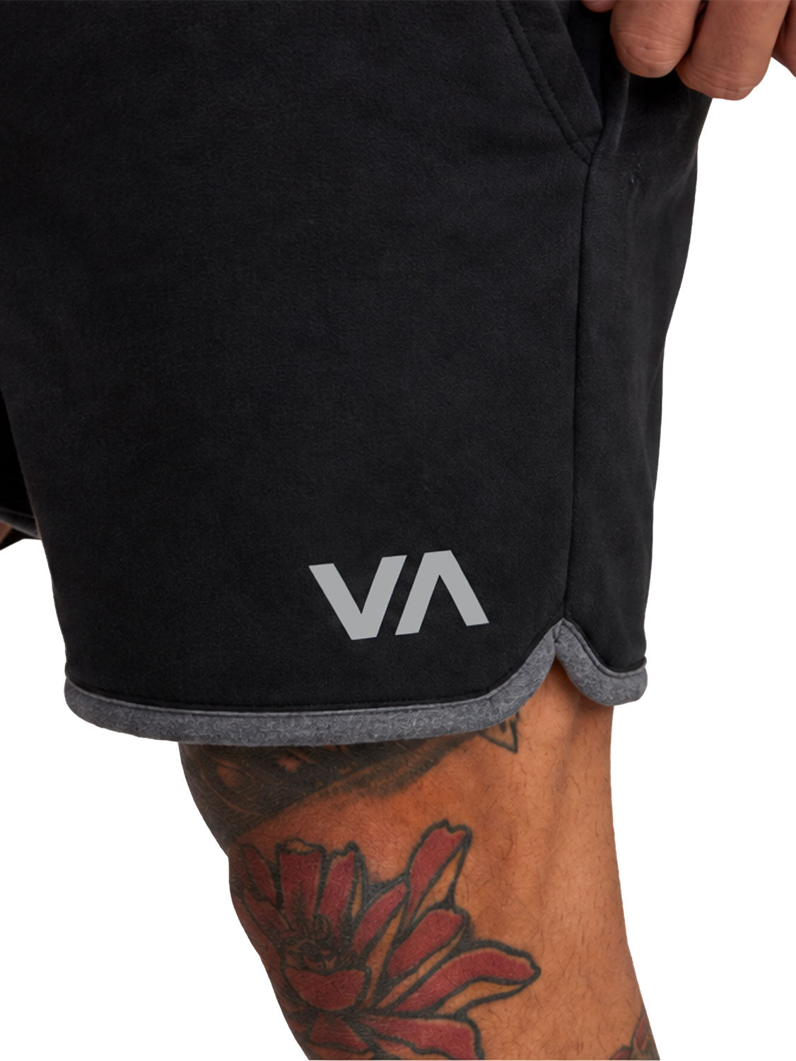 Black athletic shorts with a gray ribbed hem and a 'VA' logo on the lower left leg, Front Close Up View.