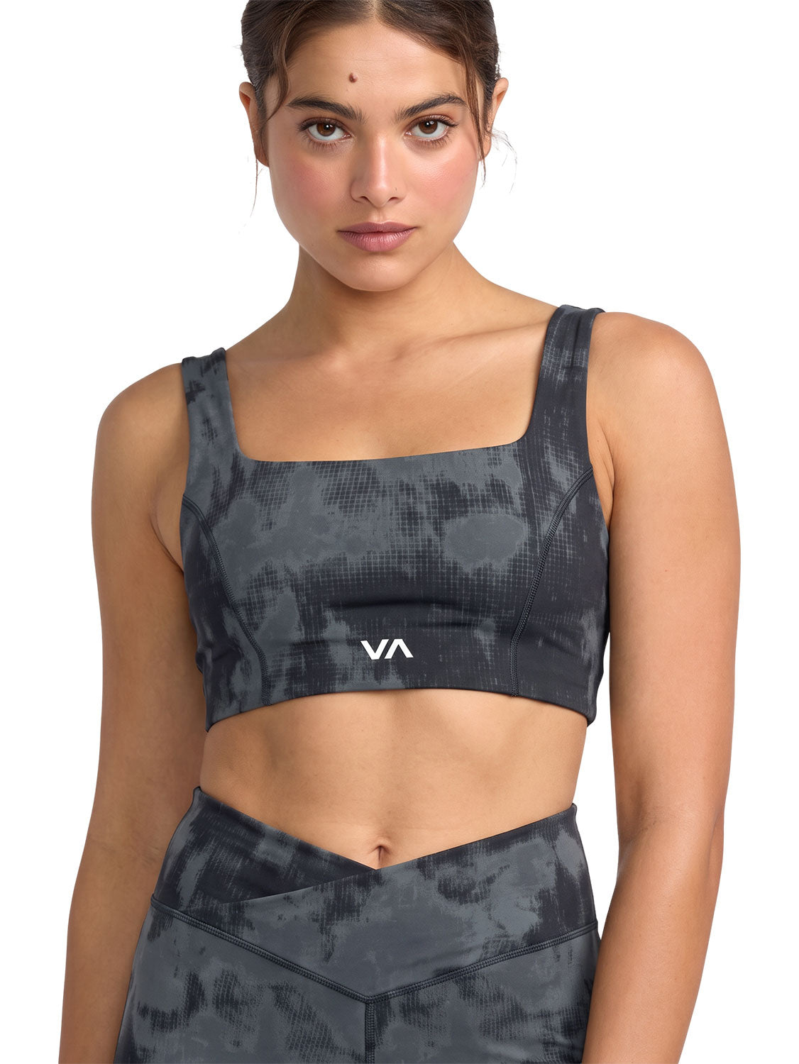 Dark gray and black tie-dye sports bra with a white 'VA' logo on the front. Front View