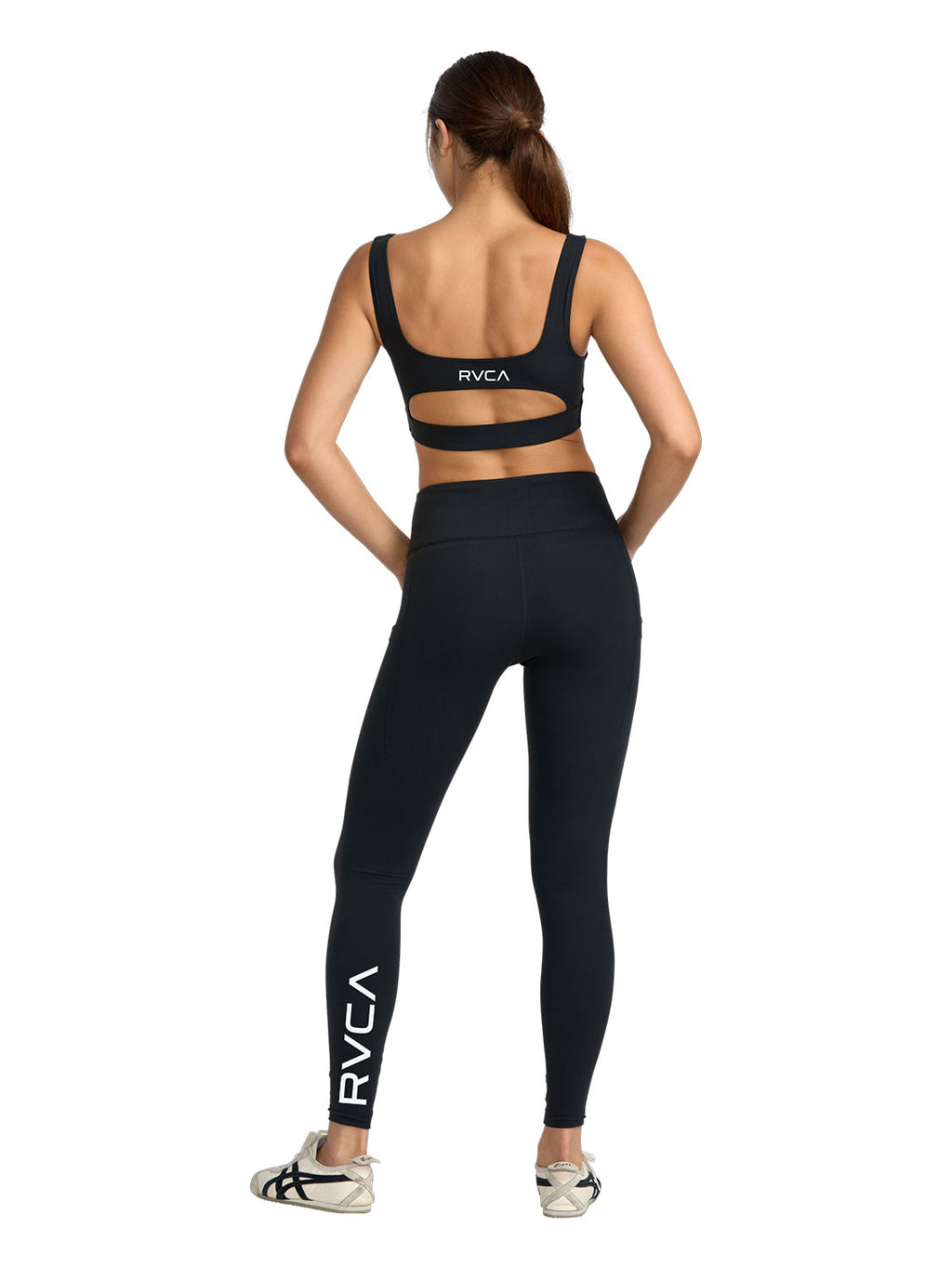 Black sports bra with a cutout. Featuring RVCA print. Back Full Body View