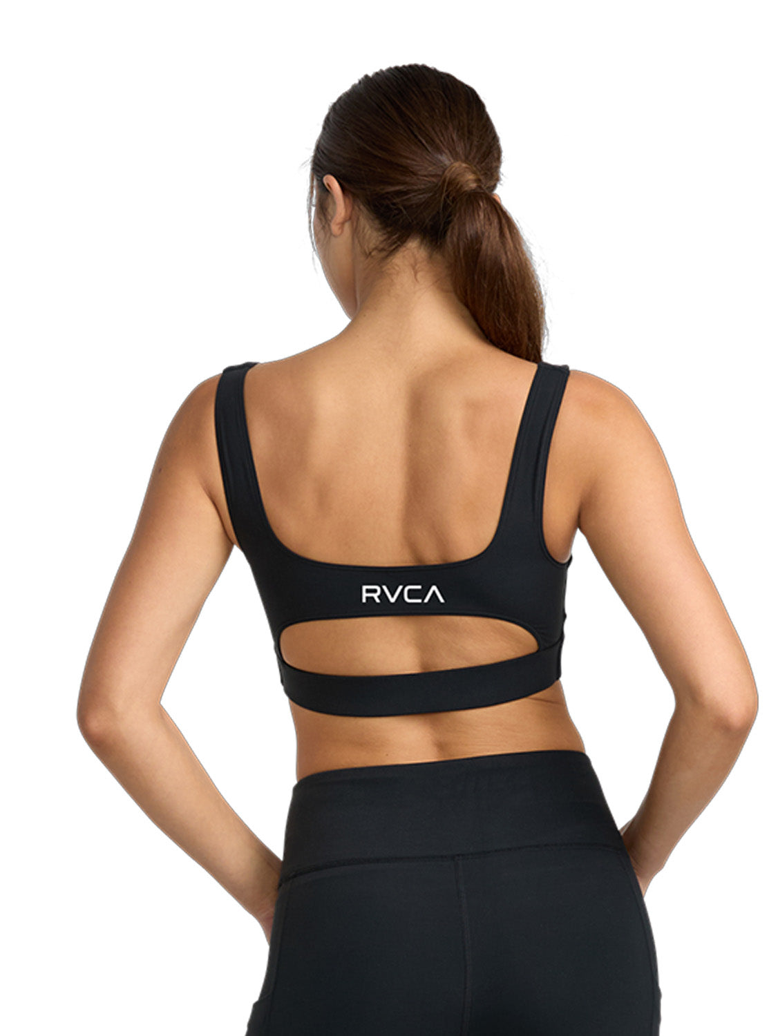 Black sports bra with a cutout. Featuring RVCA print. Back View