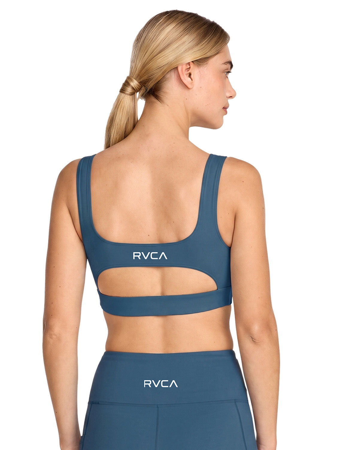 Blue sports bra with a cutout. Featuring RVCA print. Back View
