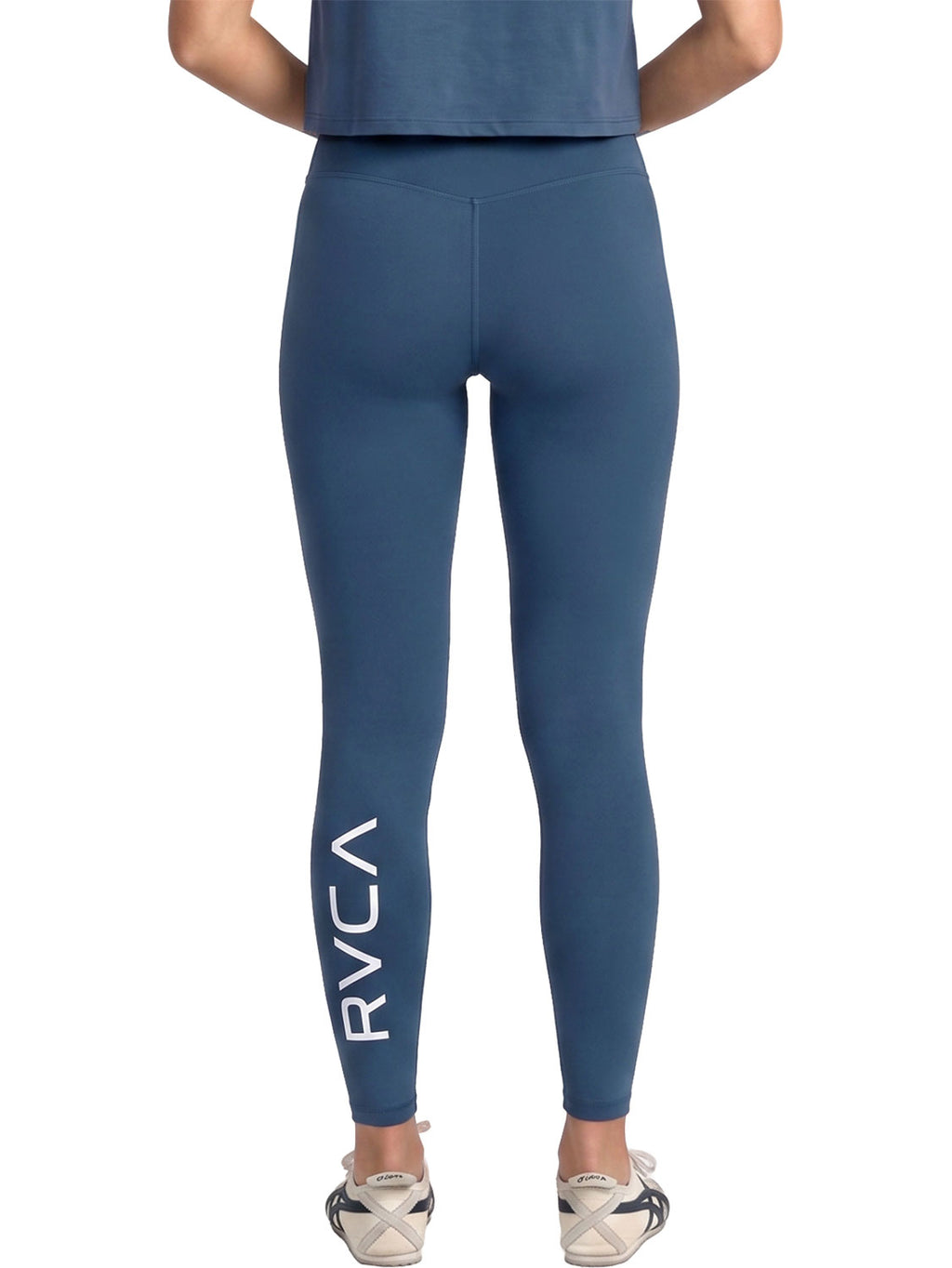 Blue high-waisted athletic leggings with a large white vertical RVCA logo on the lower left leg. Back View