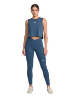 Blue sleeveless athletic crop top with small front logo. Front Full Body View