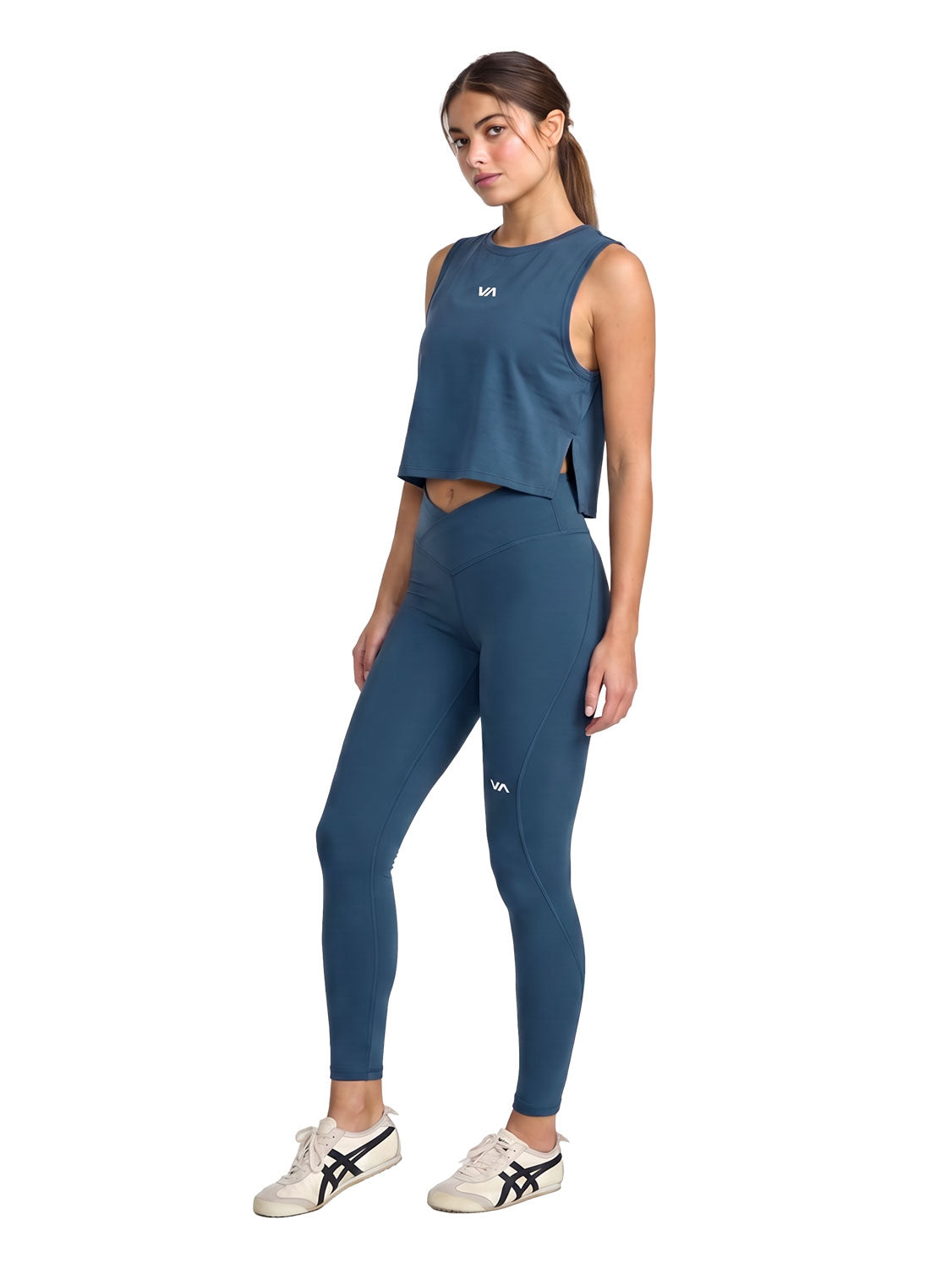 Blue sleeveless athletic crop top with small front logo. Front Full Body View