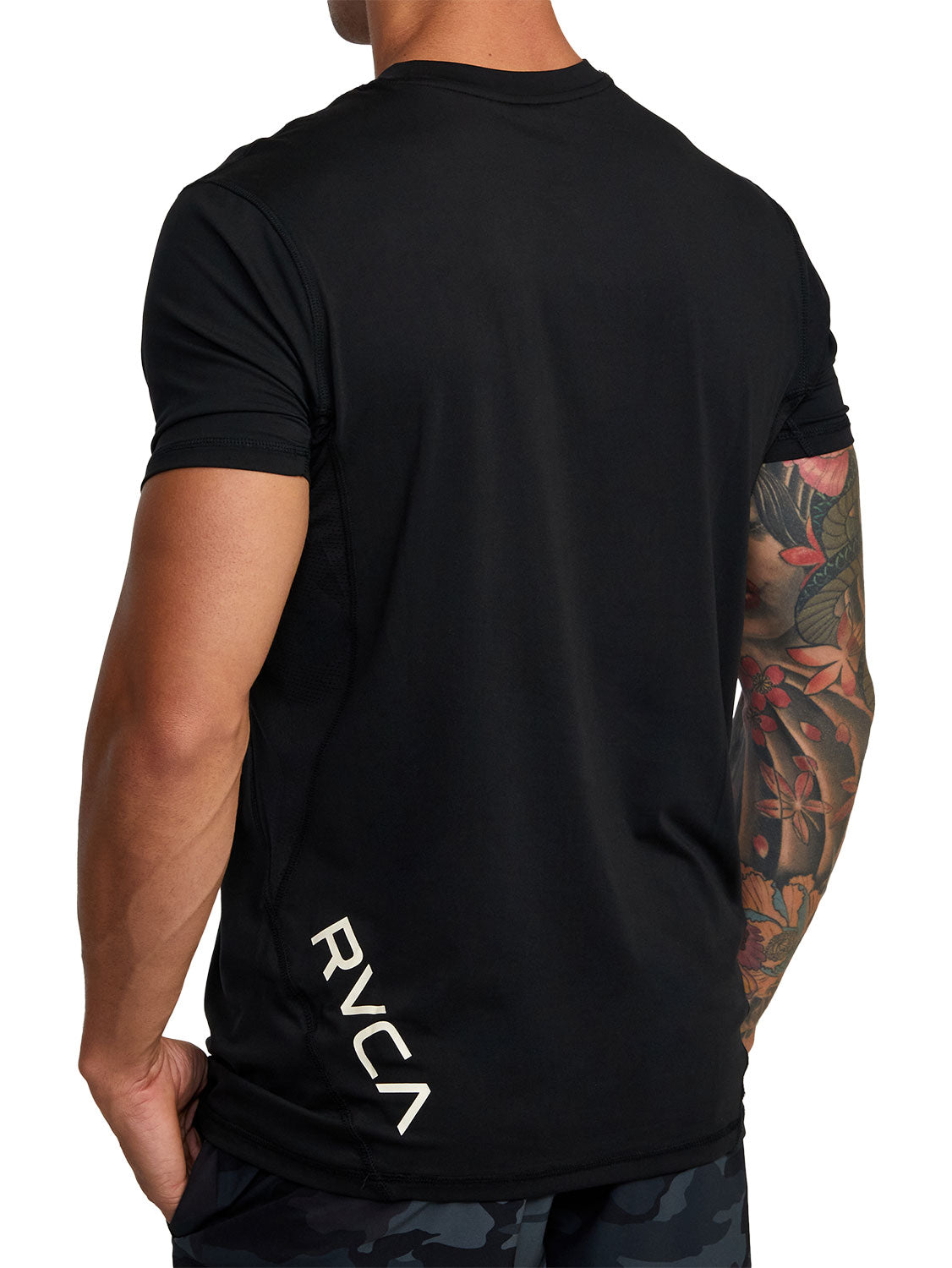 Black athletic t-shirt with a black vertical 'RVCA' logo printed on the lower back. Back View