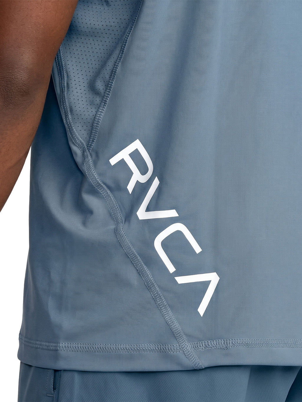 Blue athletic t-shirt with a black vertical 'RVCA' logo printed on the lower back. Back Close Up View