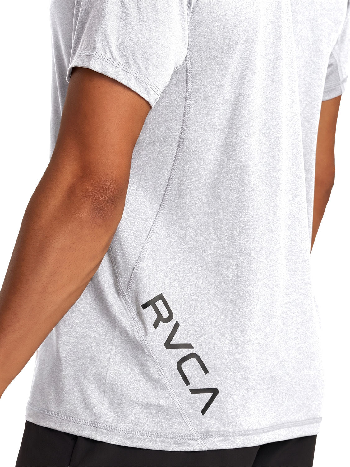Grey athletic t-shirt with a black vertical 'RVCA' logo printed on the lower back. Back Close Up View