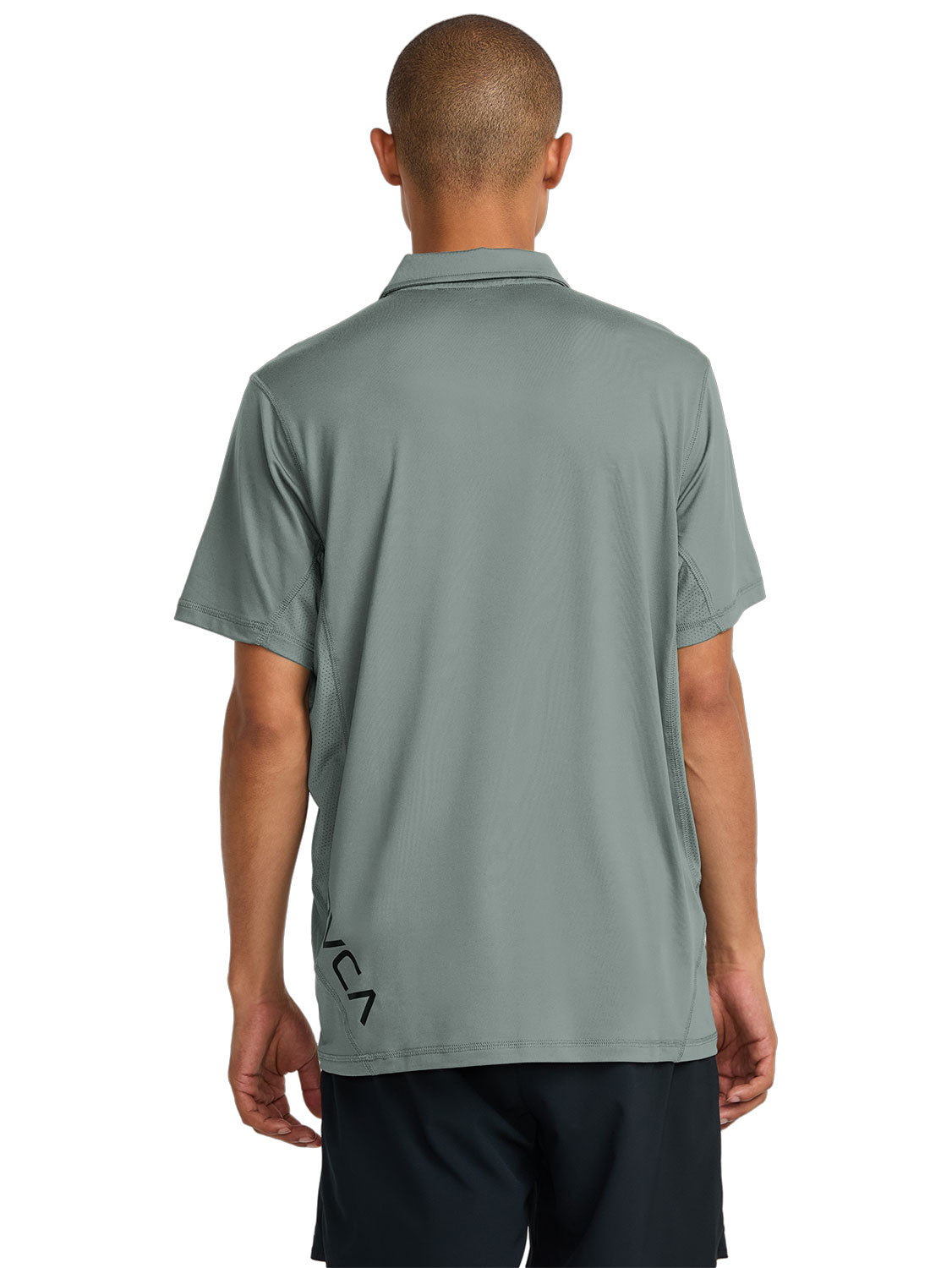Green short-sleeve polo shirt with a black RVCA logo printed vertically near the lower left side. Back View