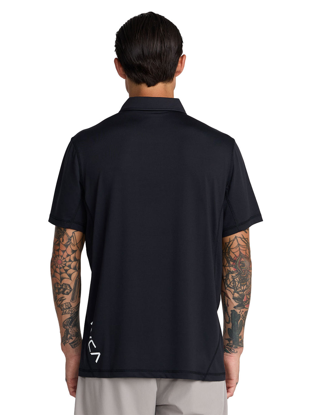 Black short-sleeve polo shirt with a black RVCA logo printed vertically near the lower left side. Back View
