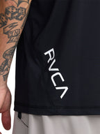 Black short-sleeve polo shirt with a black RVCA logo printed vertically near the lower left side. Back Close Up View