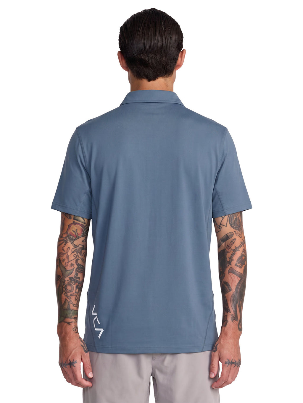 Blue short-sleeve polo shirt with a black RVCA logo printed vertically near the lower left side. Back View