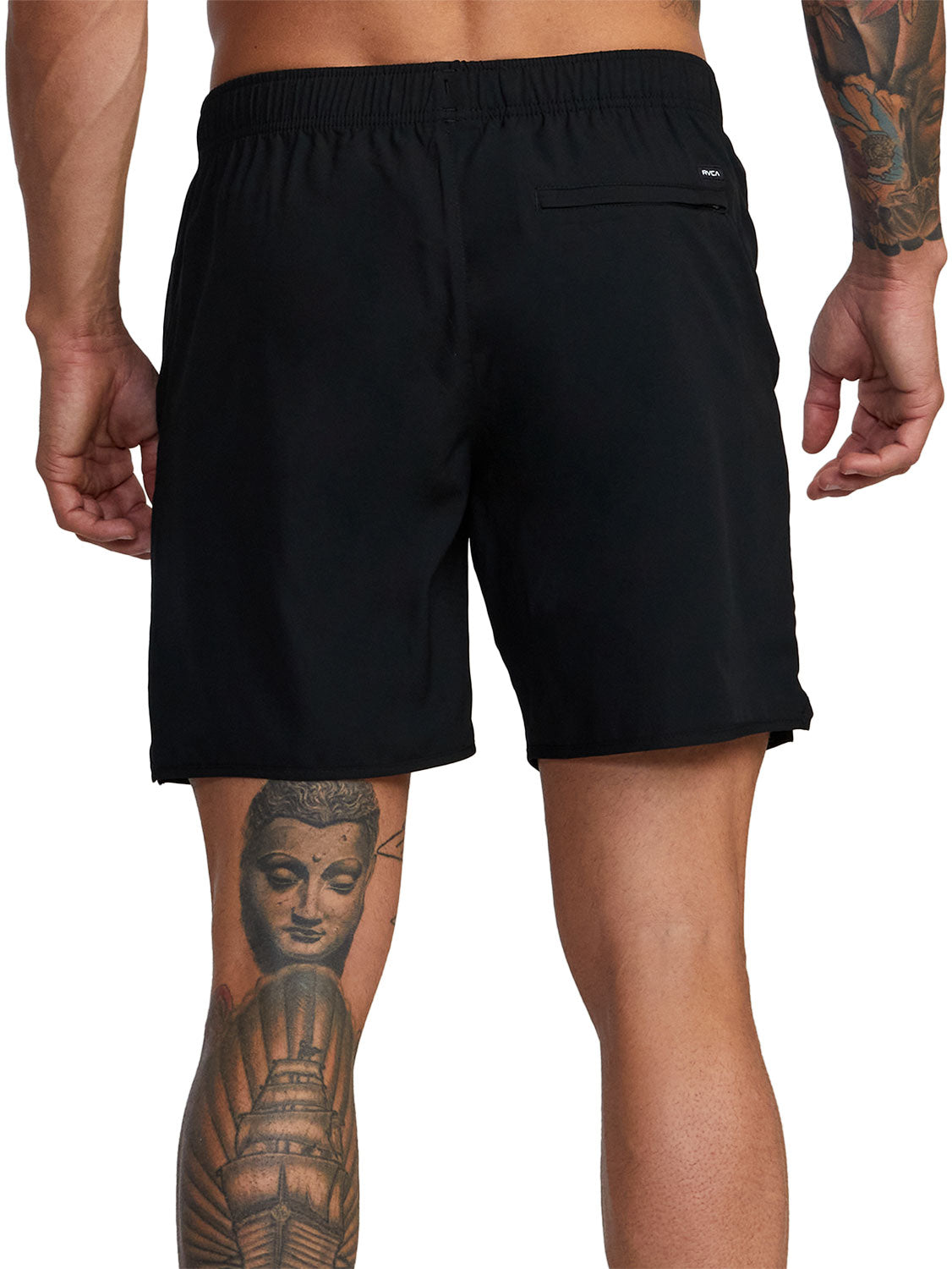 Black athletic shorts with a small white logo patch on the back pocket. Back View.
