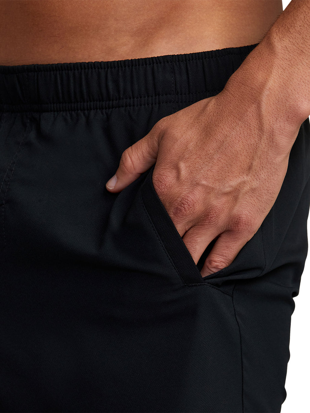 Black athletic shorts, showing the side pocket 